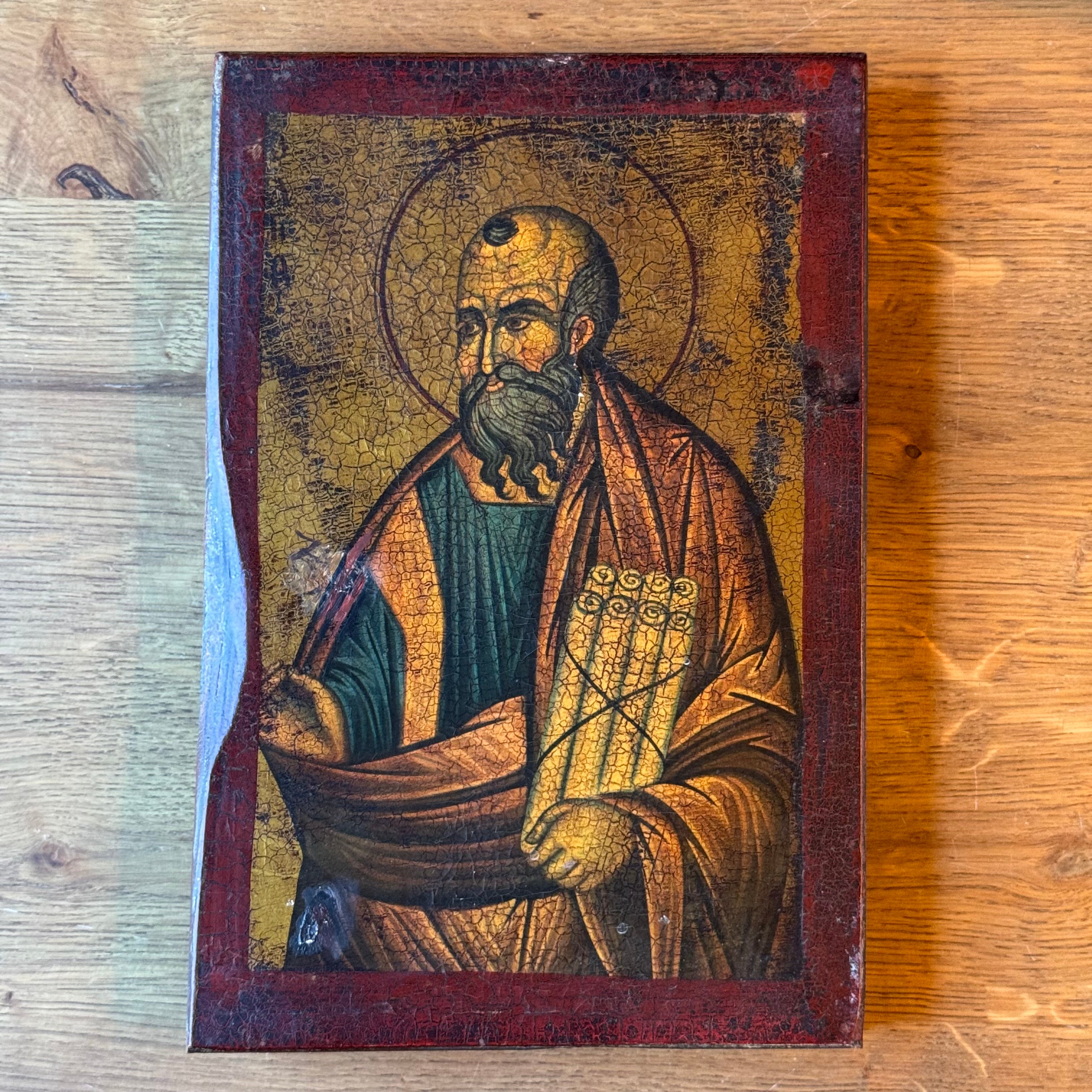 Decorative icon of an apostle on a wooden panel with a crackle patina