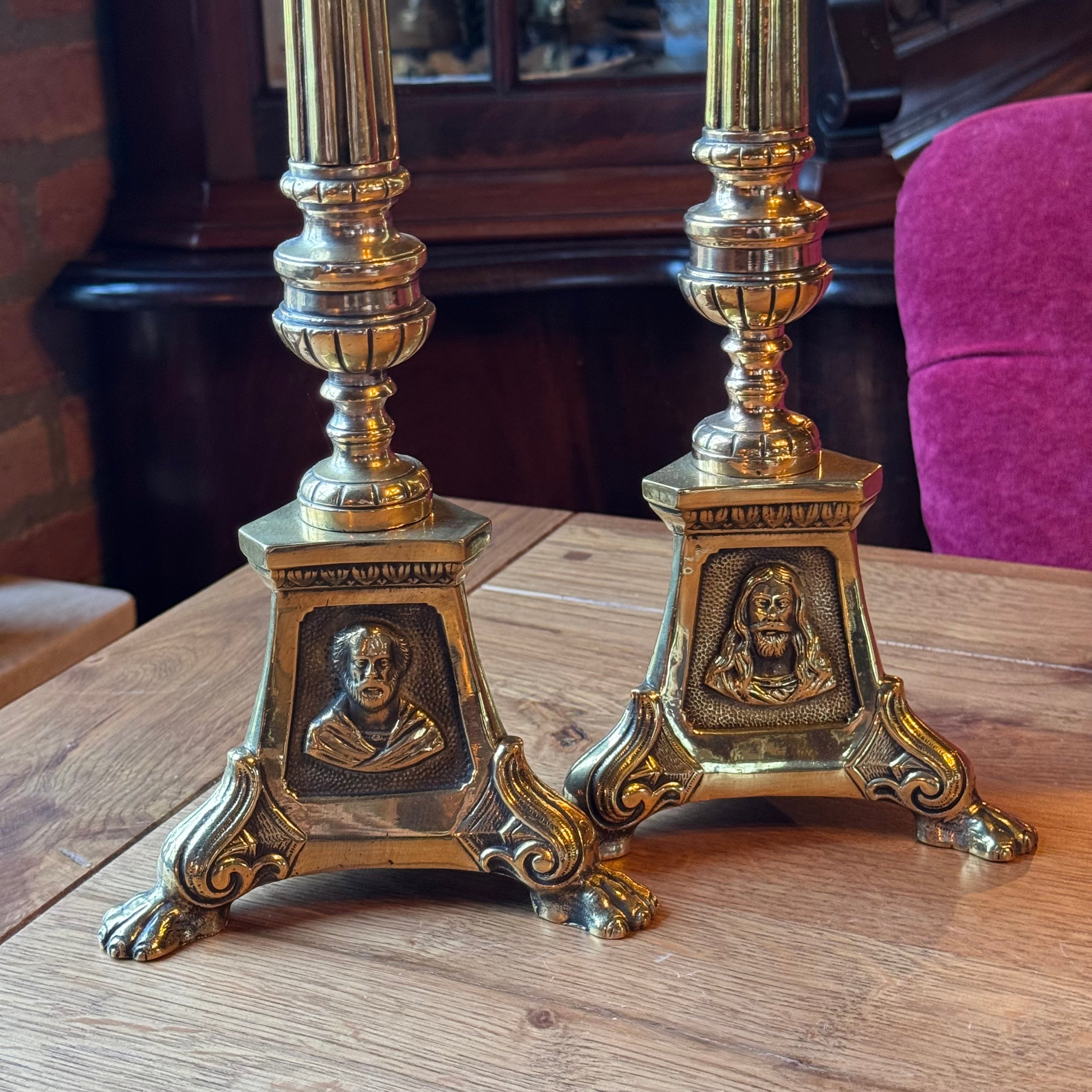 Antique ecclesiastical brass candlesticks with saints – set of 2