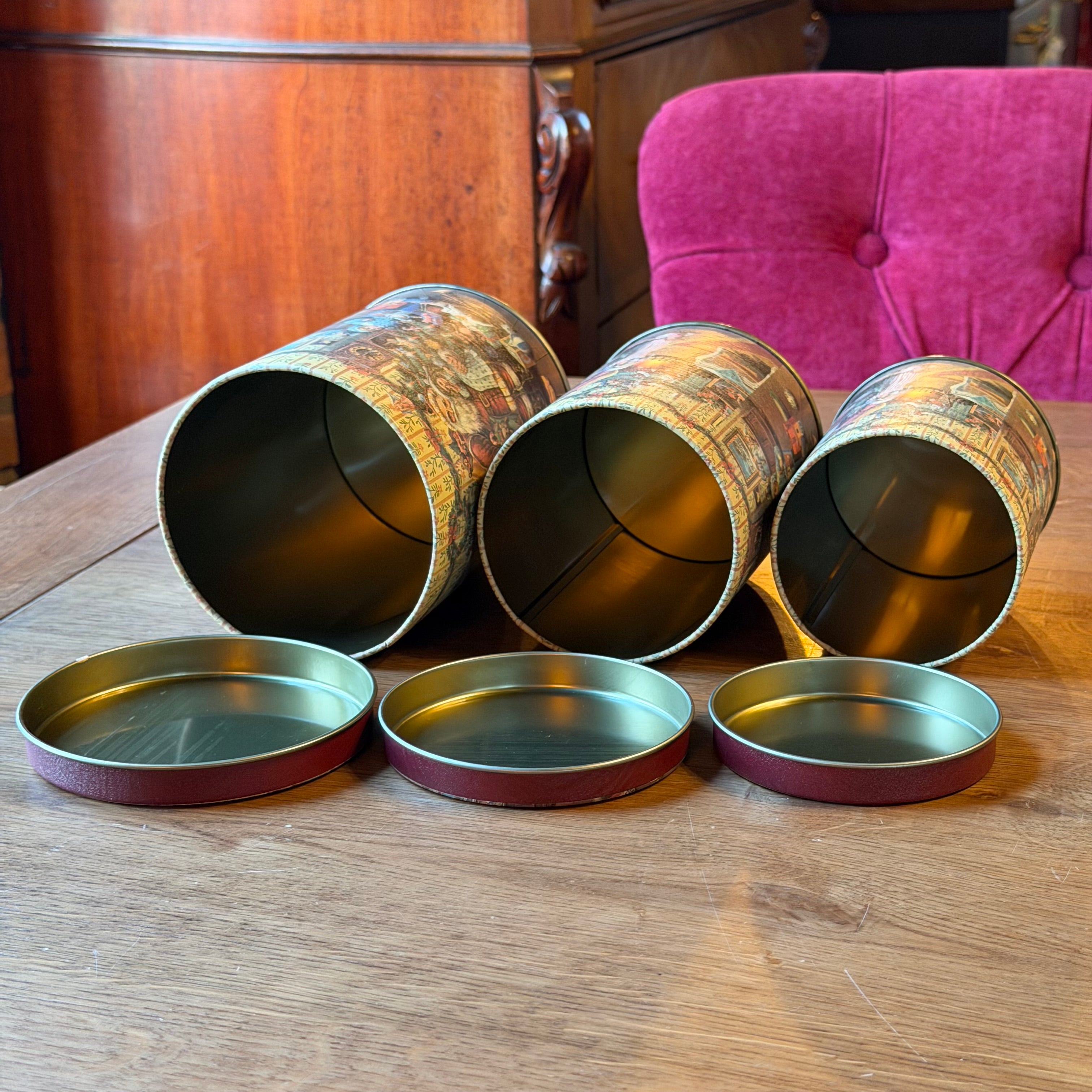 Set of three Christmas tins with a nostalgic Santa Claus illustration