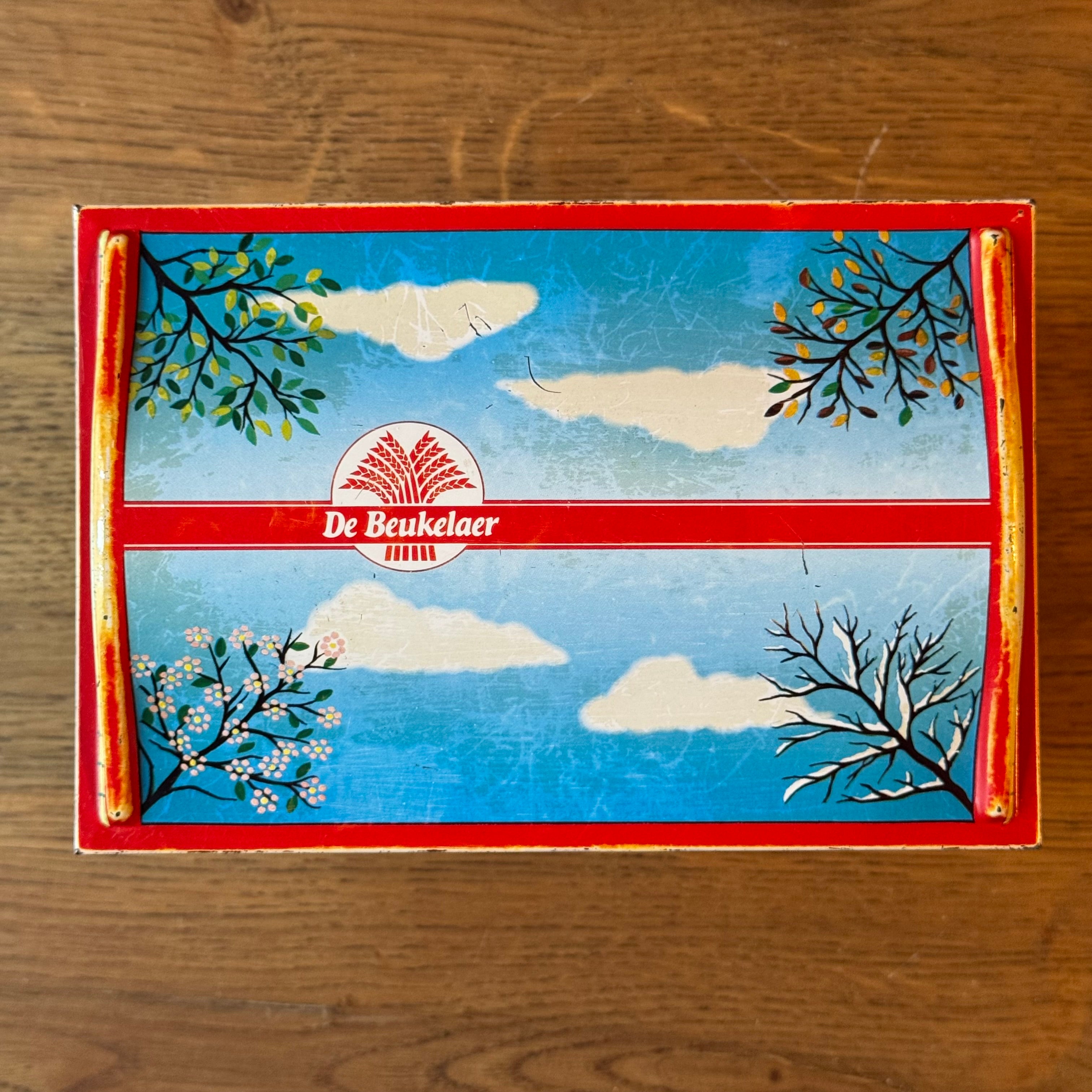 Vintage De Beukelaer tin drum with seasonal illustrations