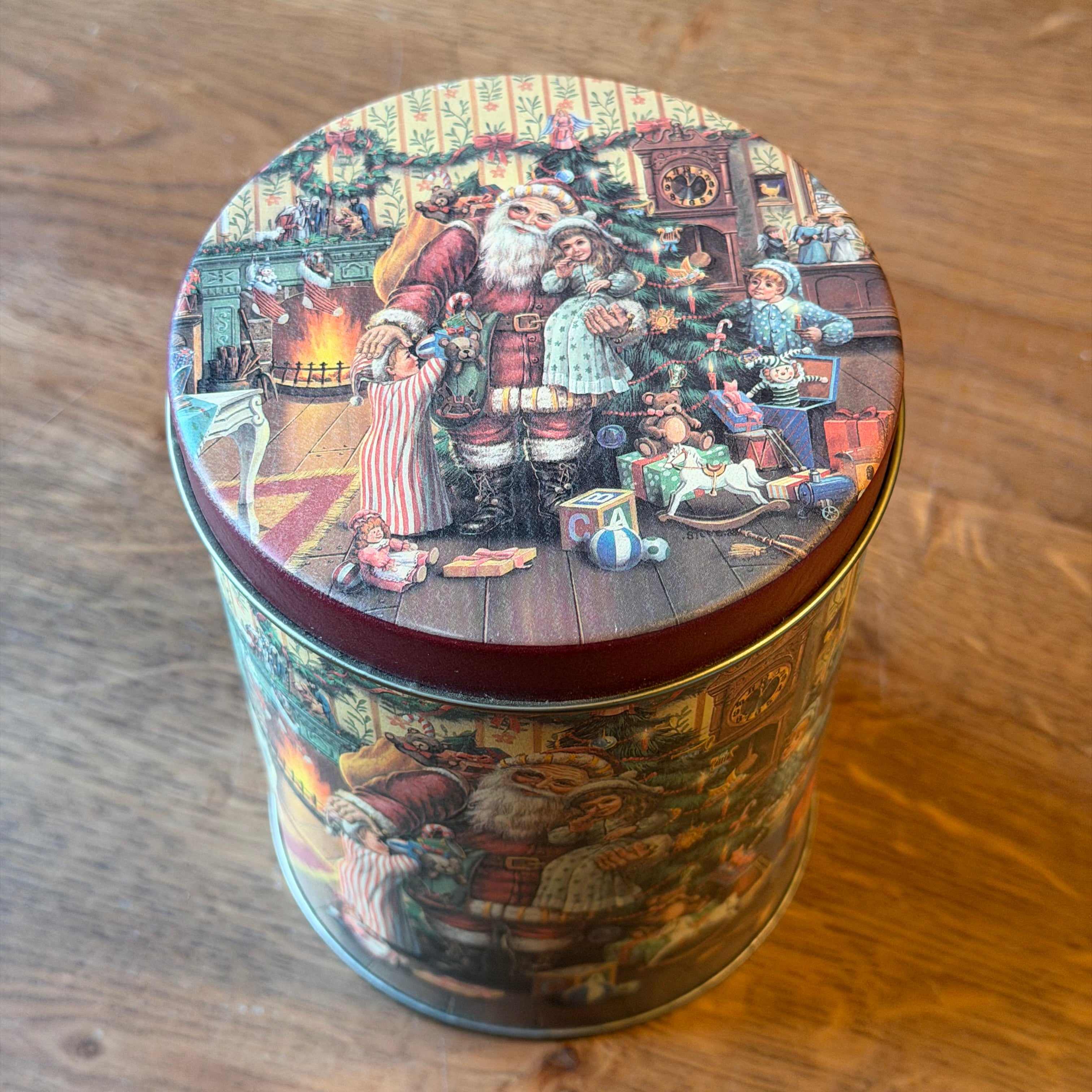 Set of three Christmas tins with a nostalgic Santa Claus illustration