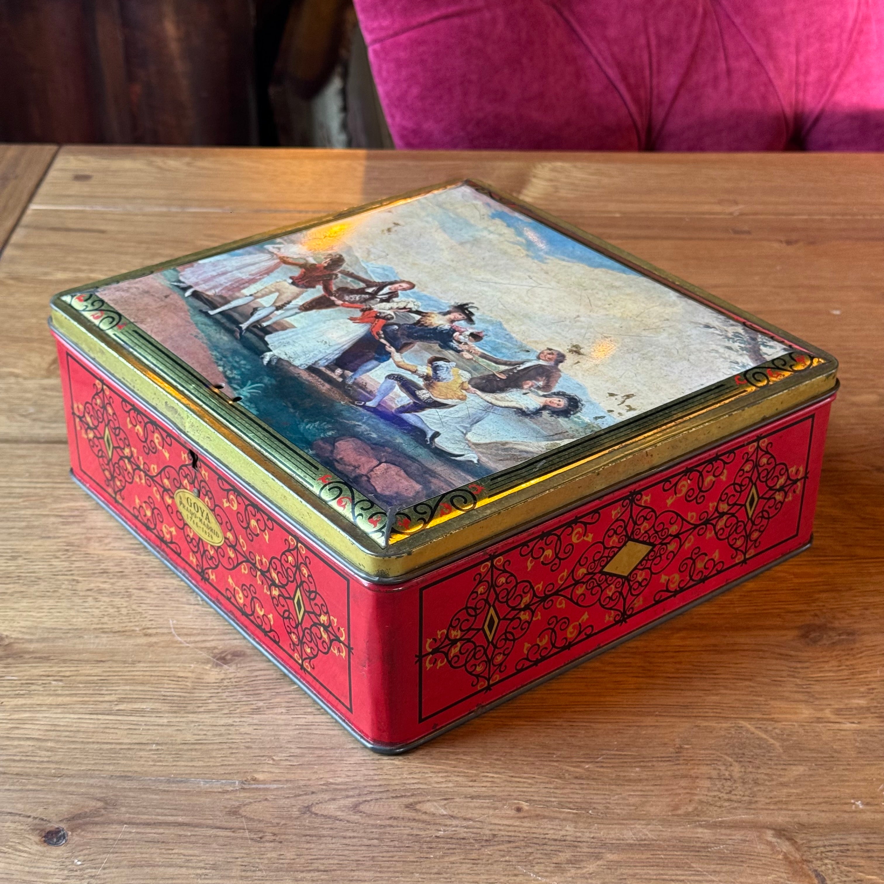 Large red Goya tin with 18th century dance scene, Demaret Confiserie