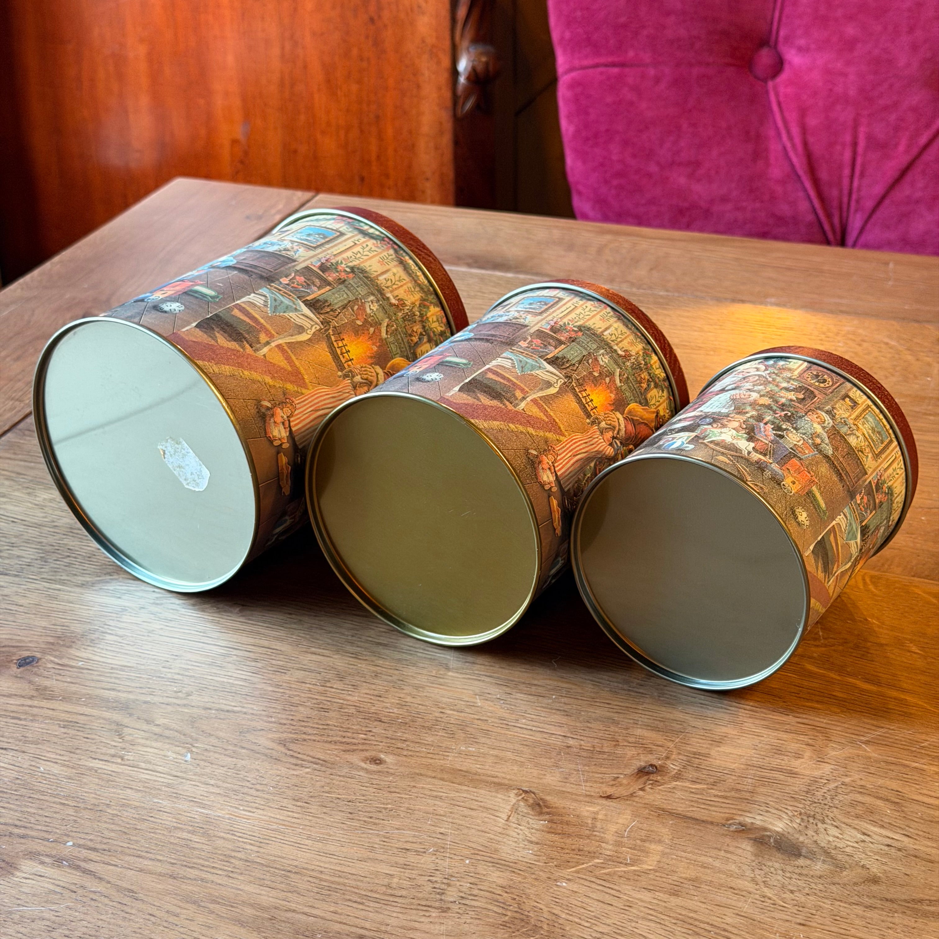Set of three Christmas tins with a nostalgic Santa Claus illustration