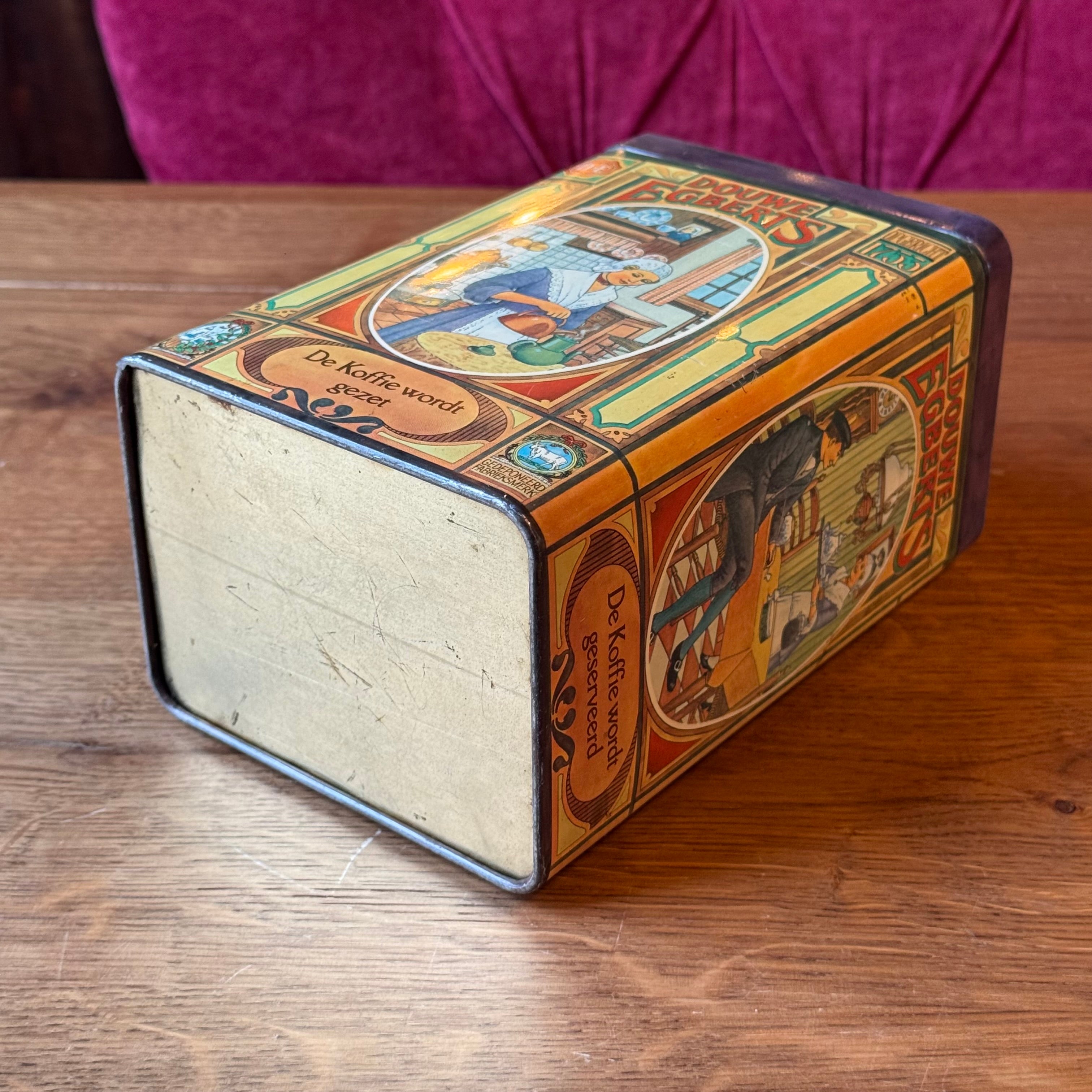 Antique Douwe Egberts coffee tin with scenes from the coffee ritual