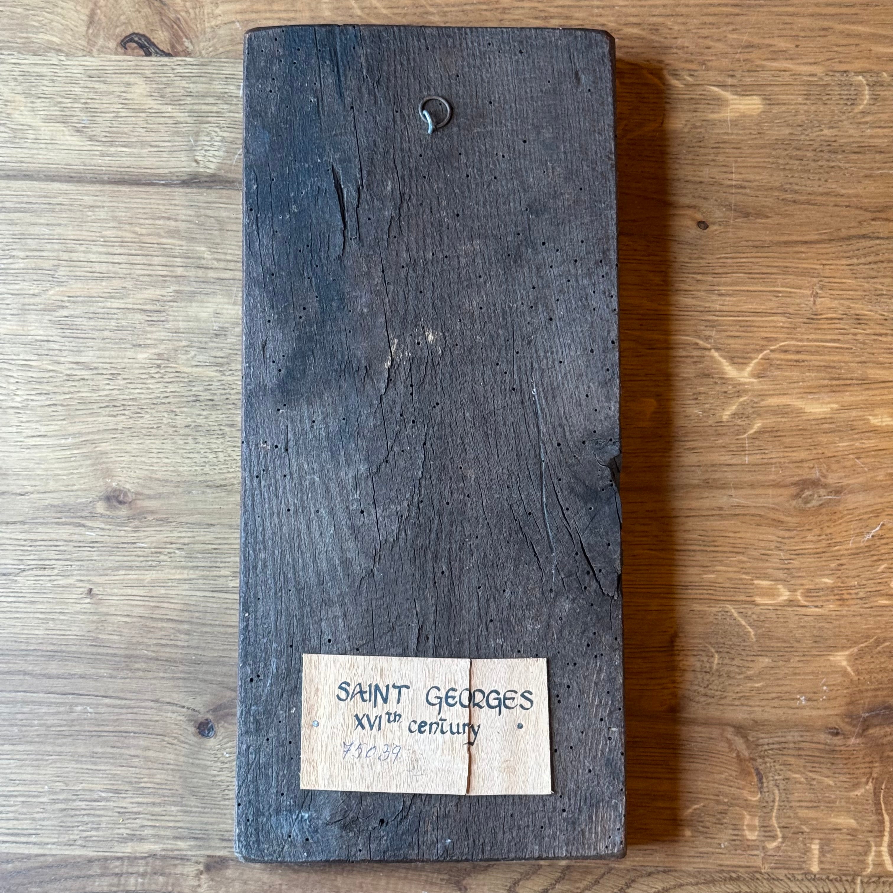 Icon of Saint George in richly decorated robes on wooden panel