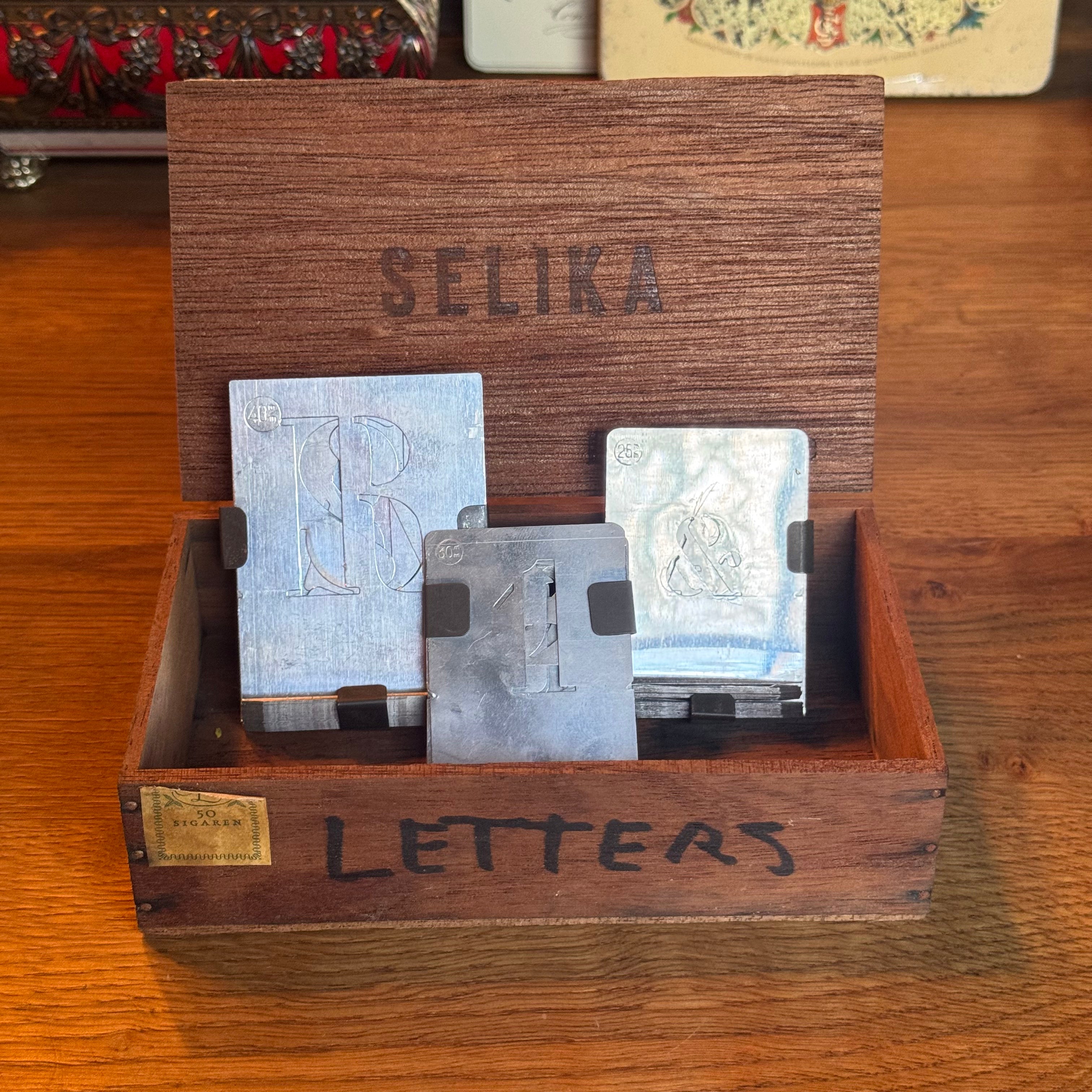 Box with letter and number stencils