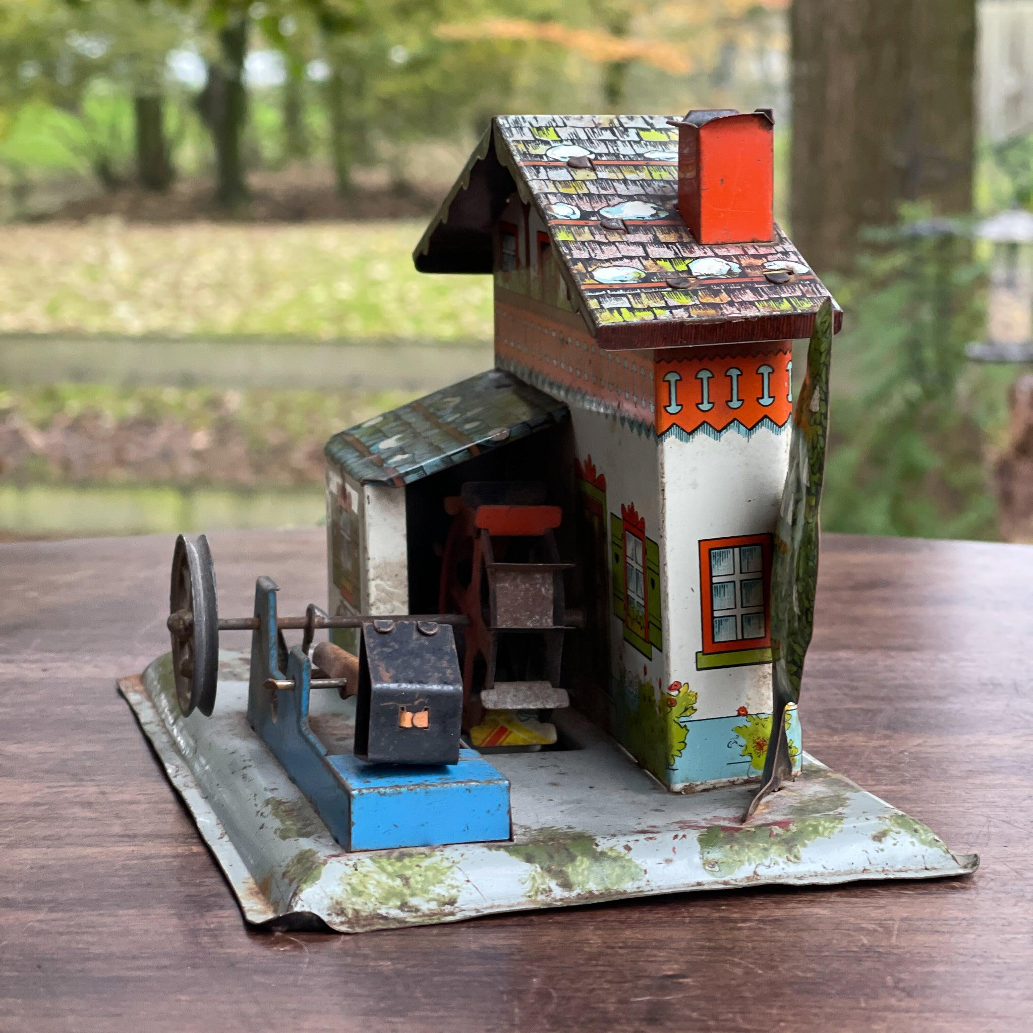 Antieke blikken watermolen voor stoommachine - The Collectionist