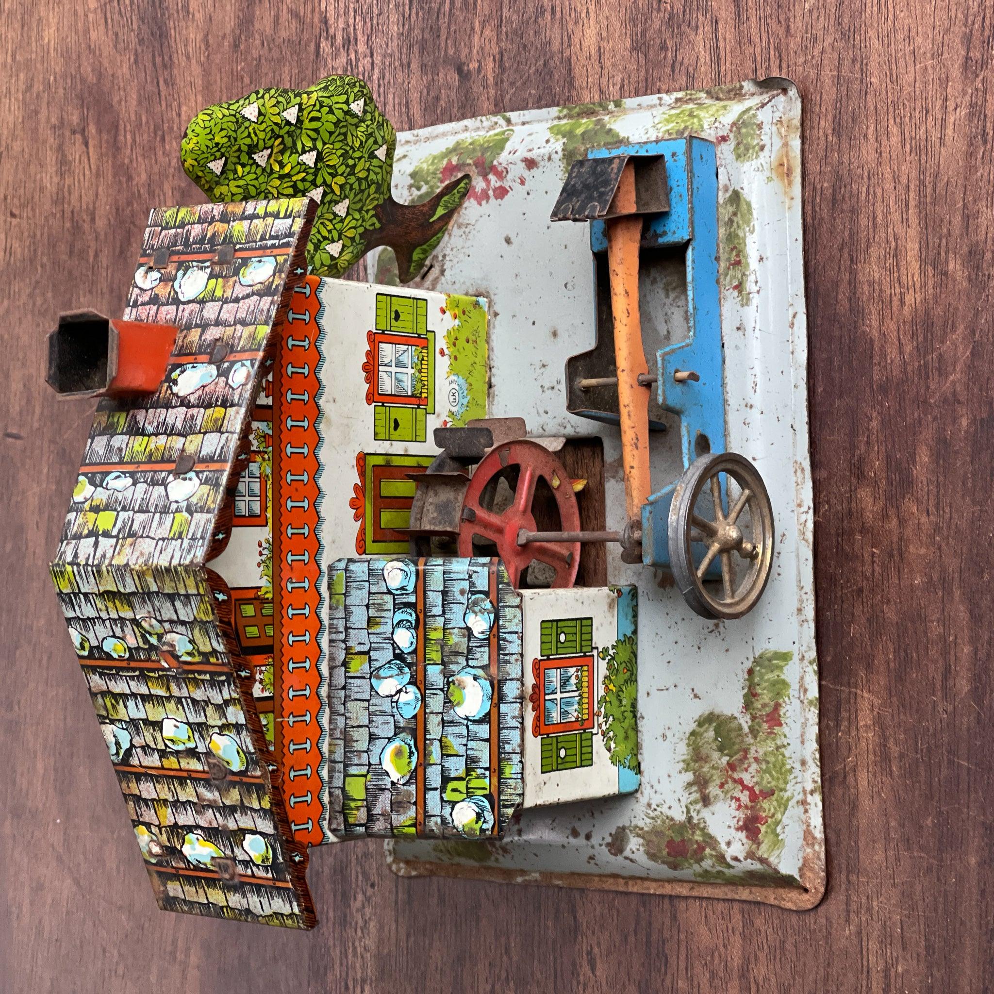 Antieke blikken watermolen voor stoommachine - The Collectionist