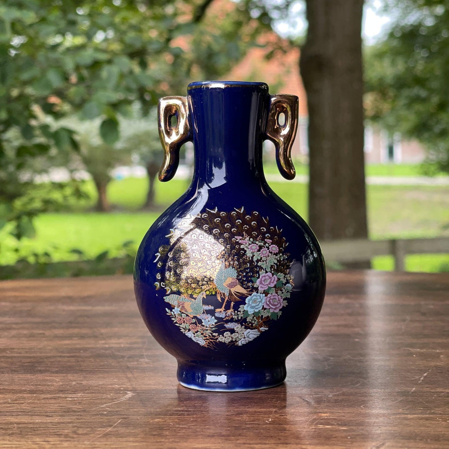 Klein blauw vaasje met een Pauw - Bamestra Curiosa