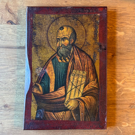 Decorative icon of an apostle on a wooden panel with a crackle patina