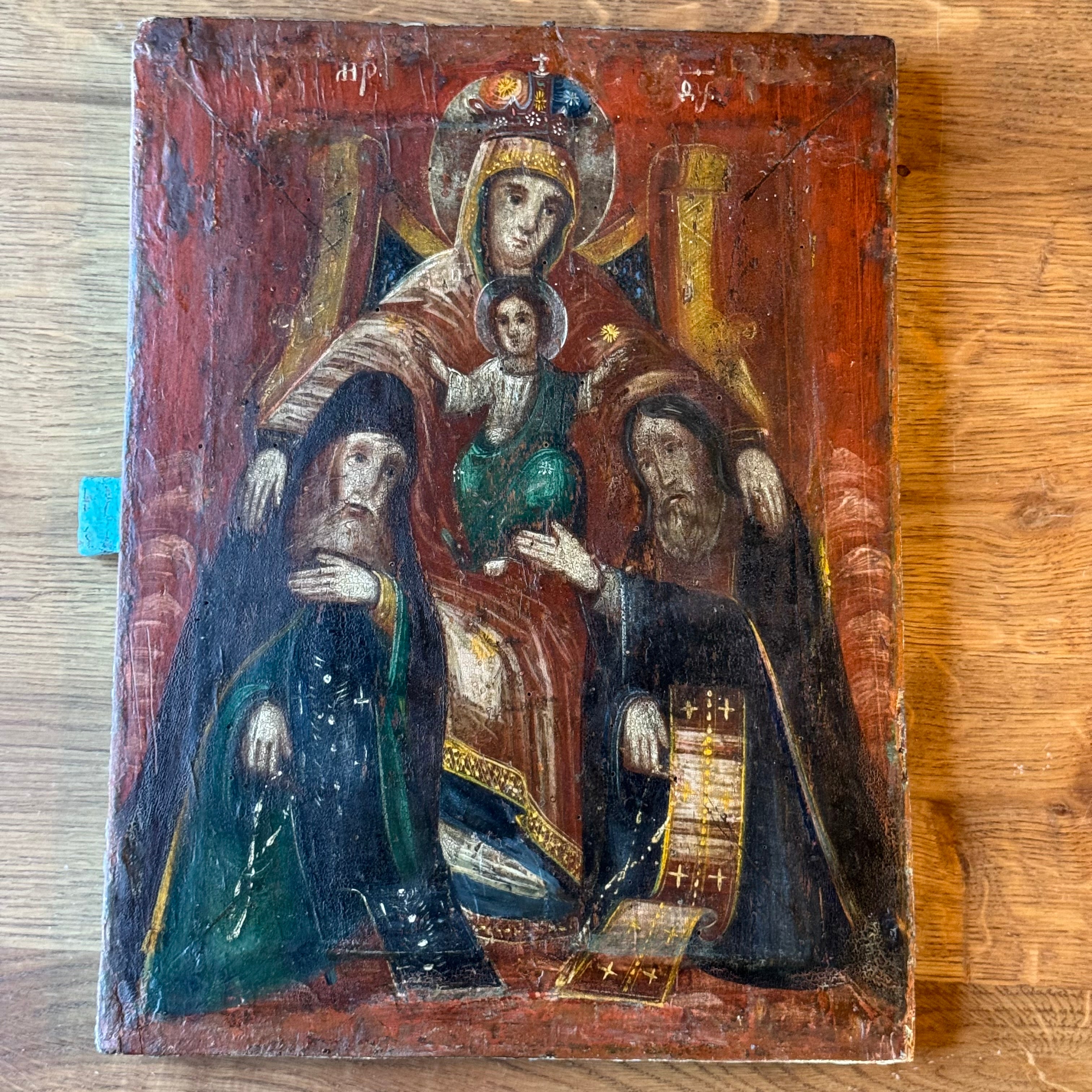 Decorative icon "Mother of God on the Throne with Monks" on a wooden panel