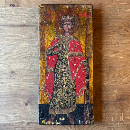 Icon of Saint George in richly decorated robes on wooden panel