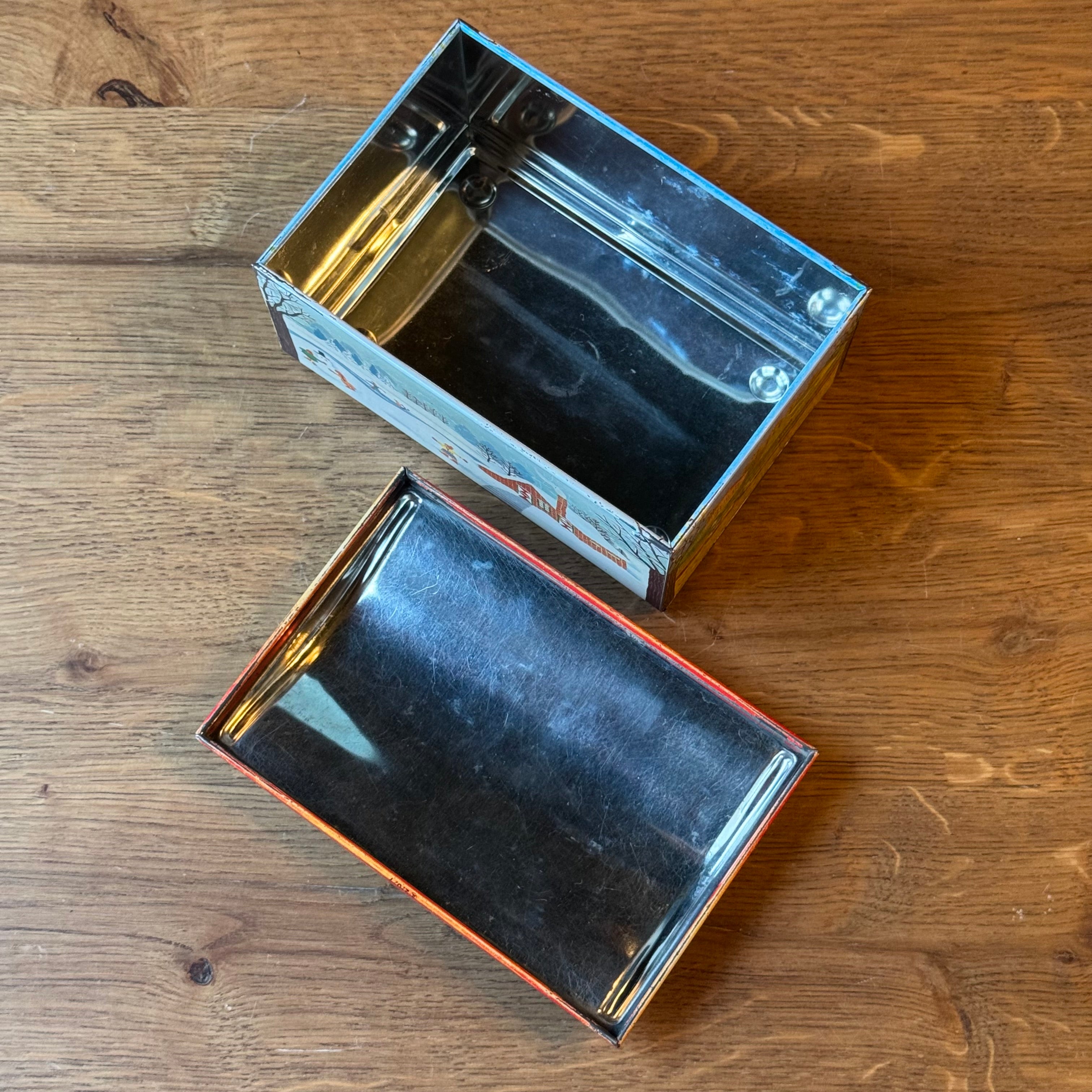 Vintage De Beukelaer tin drum with seasonal illustrations