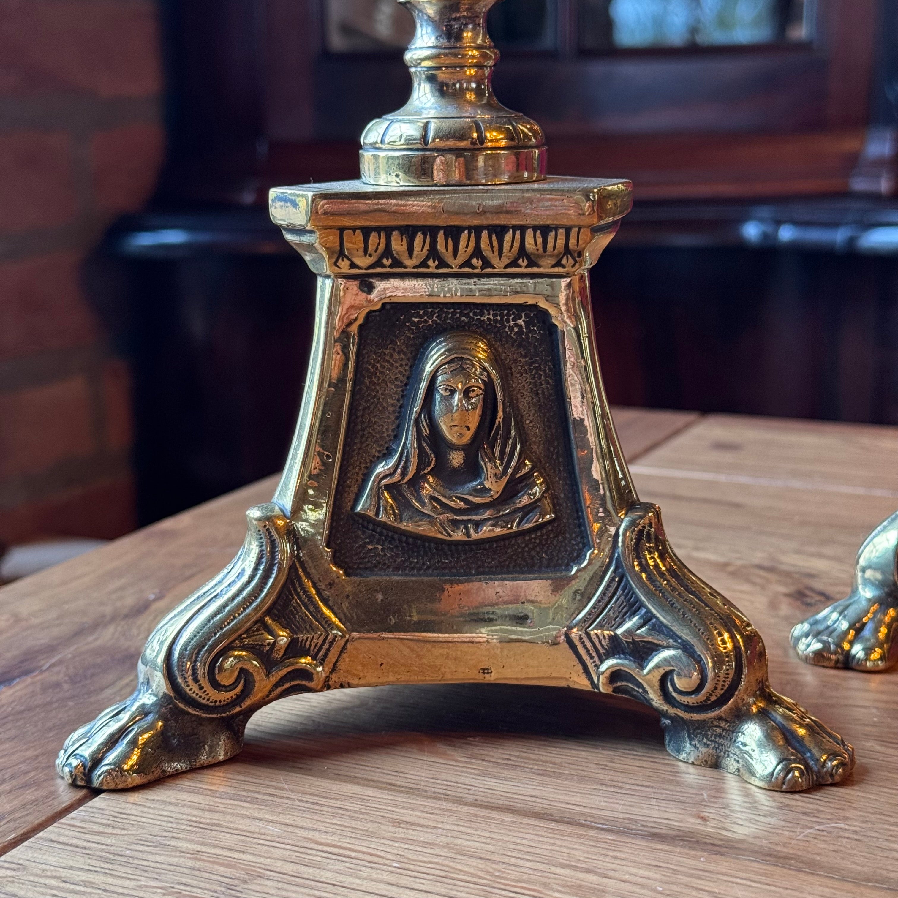 Antique ecclesiastical brass candlesticks with saints – set of 2