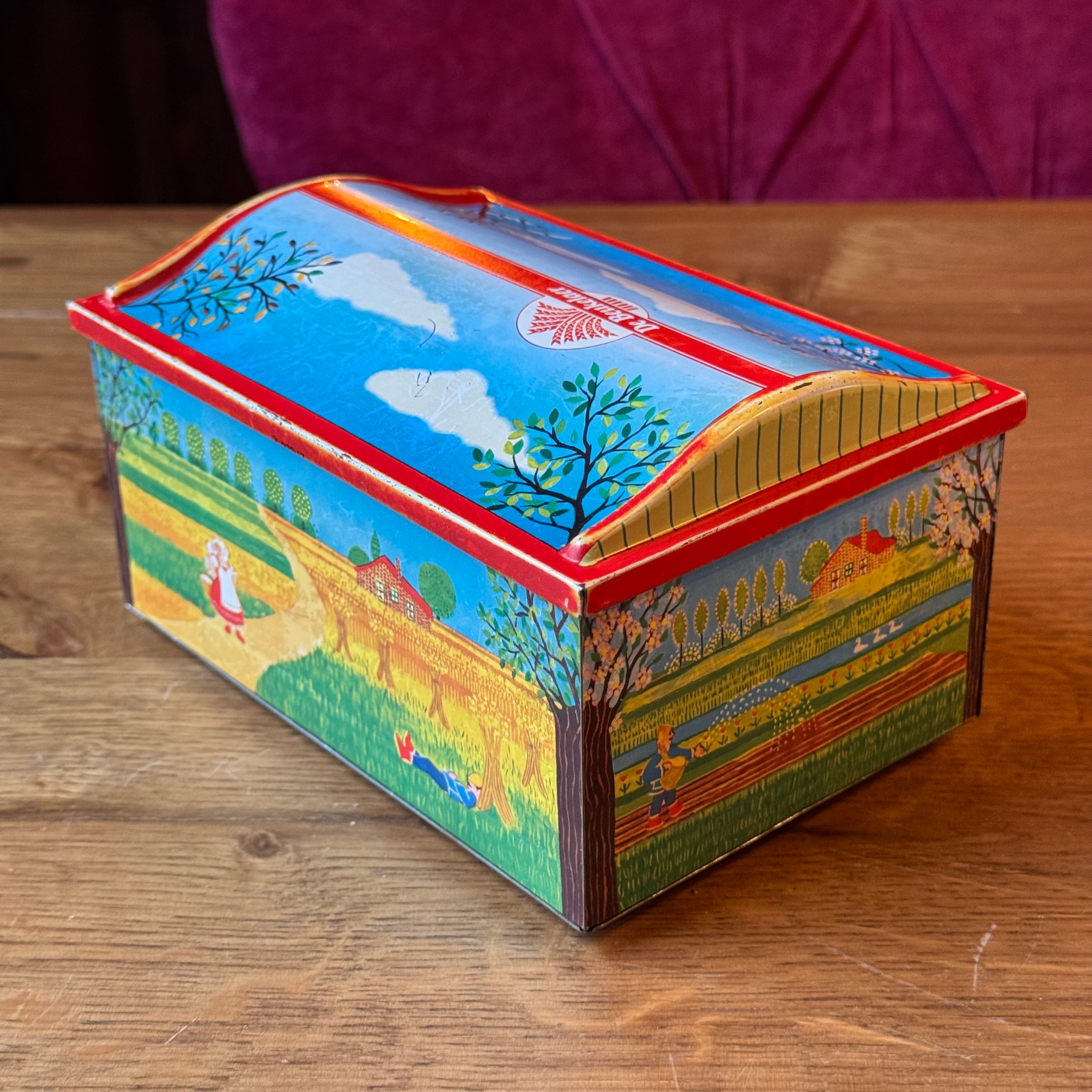 Vintage De Beukelaer tin drum with seasonal illustrations