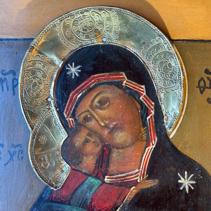 Decorative icon "Mother of God Eleusa" with brass riza on wooden panel
