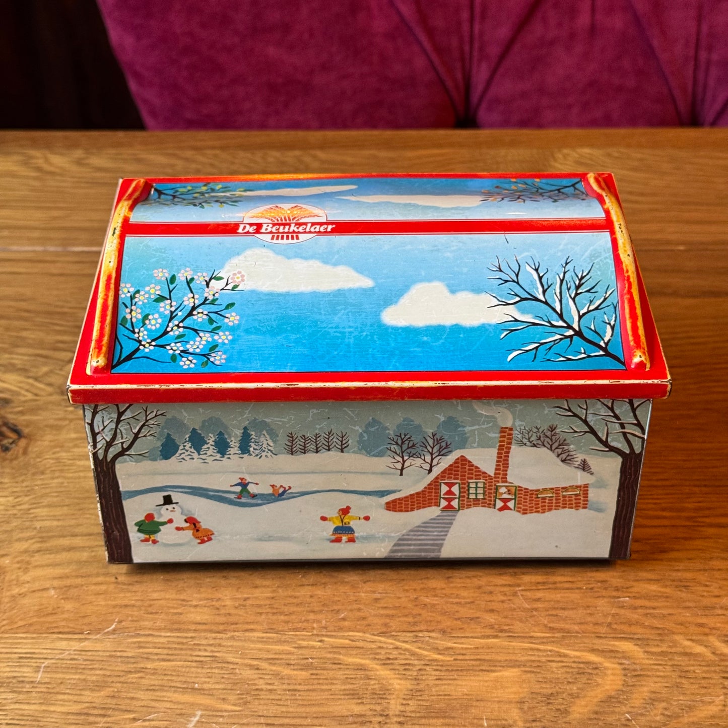 Vintage De Beukelaer blikken trommel met seizoensillustraties