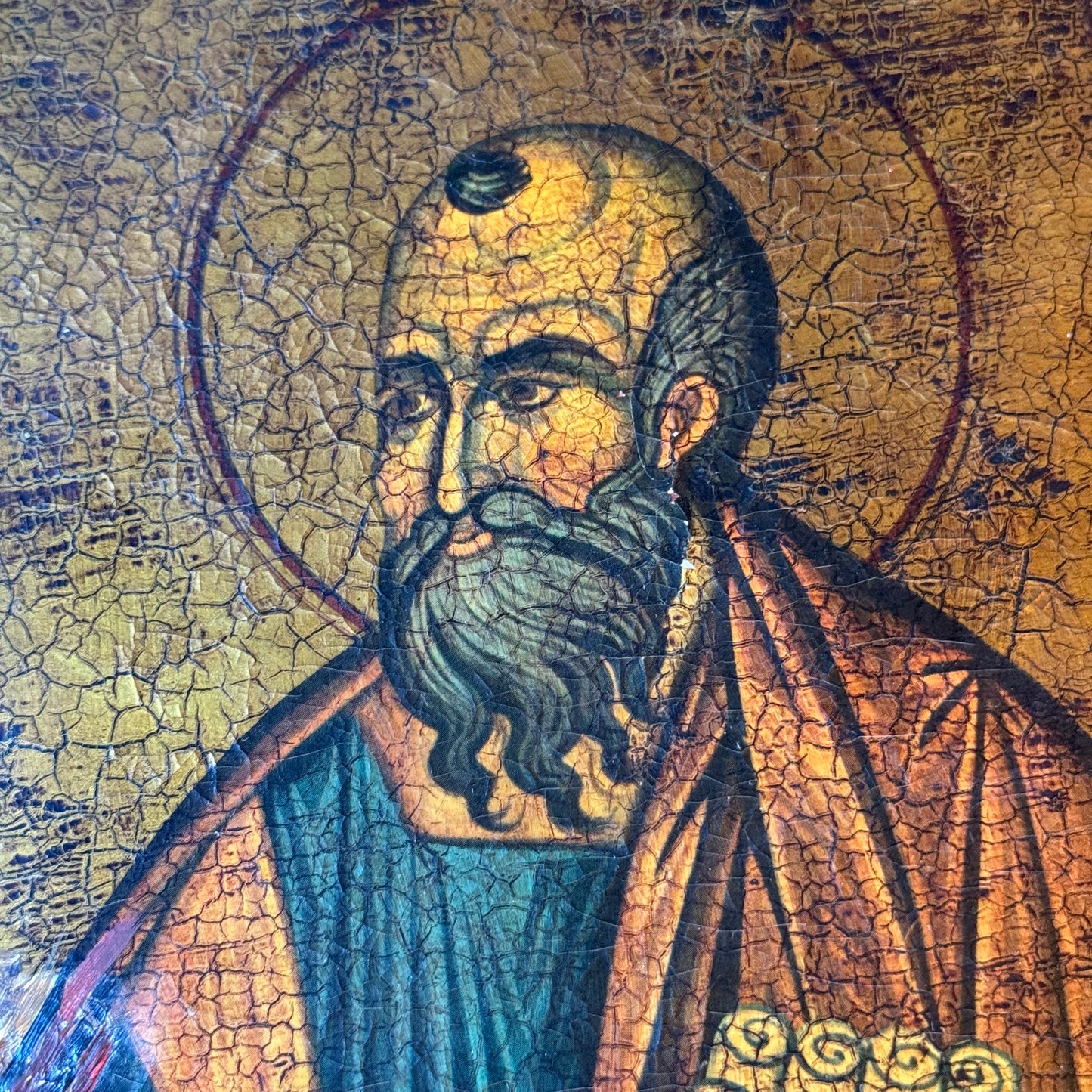 Decorative icon of an apostle on a wooden panel with a crackle patina