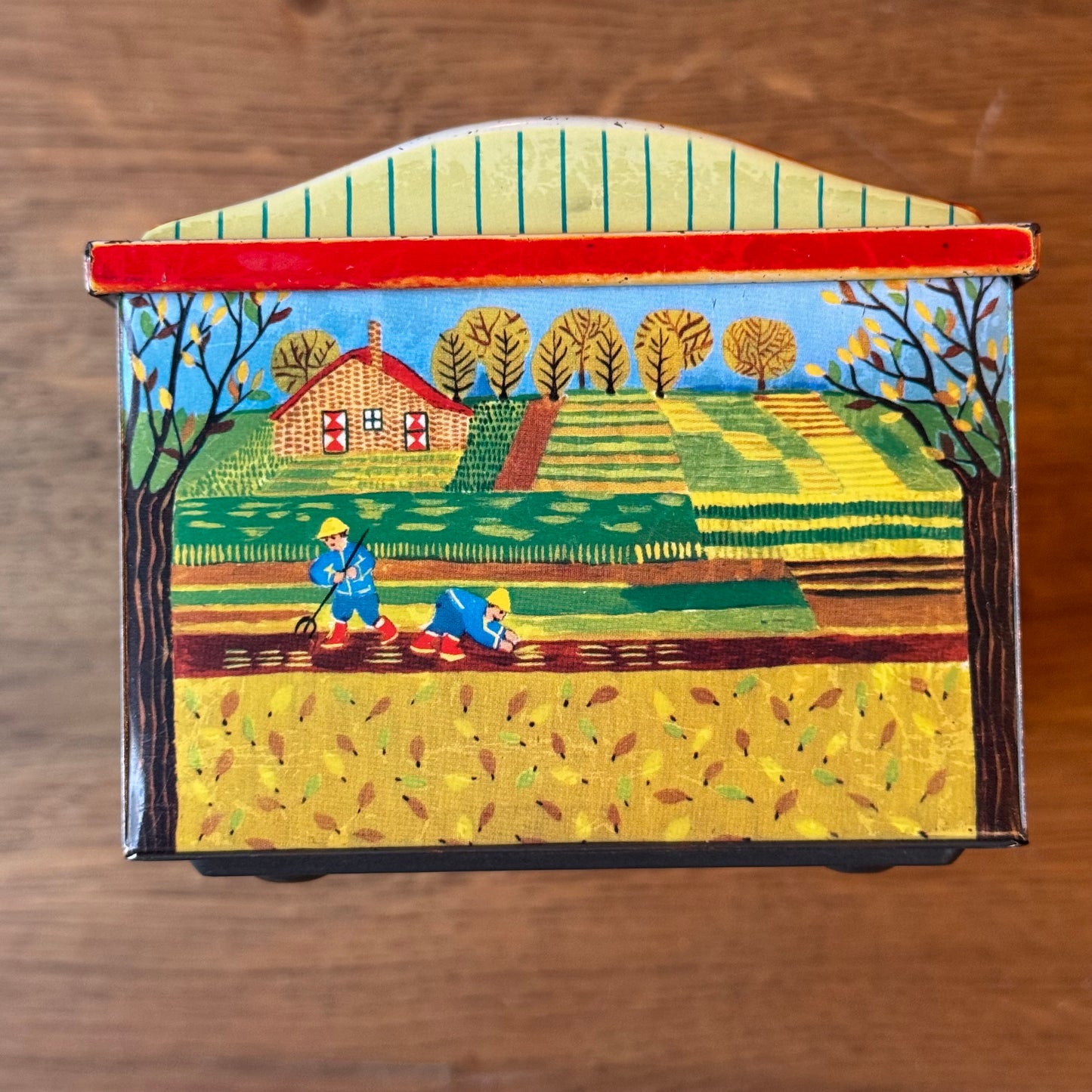 Vintage De Beukelaer blikken trommel met seizoensillustraties