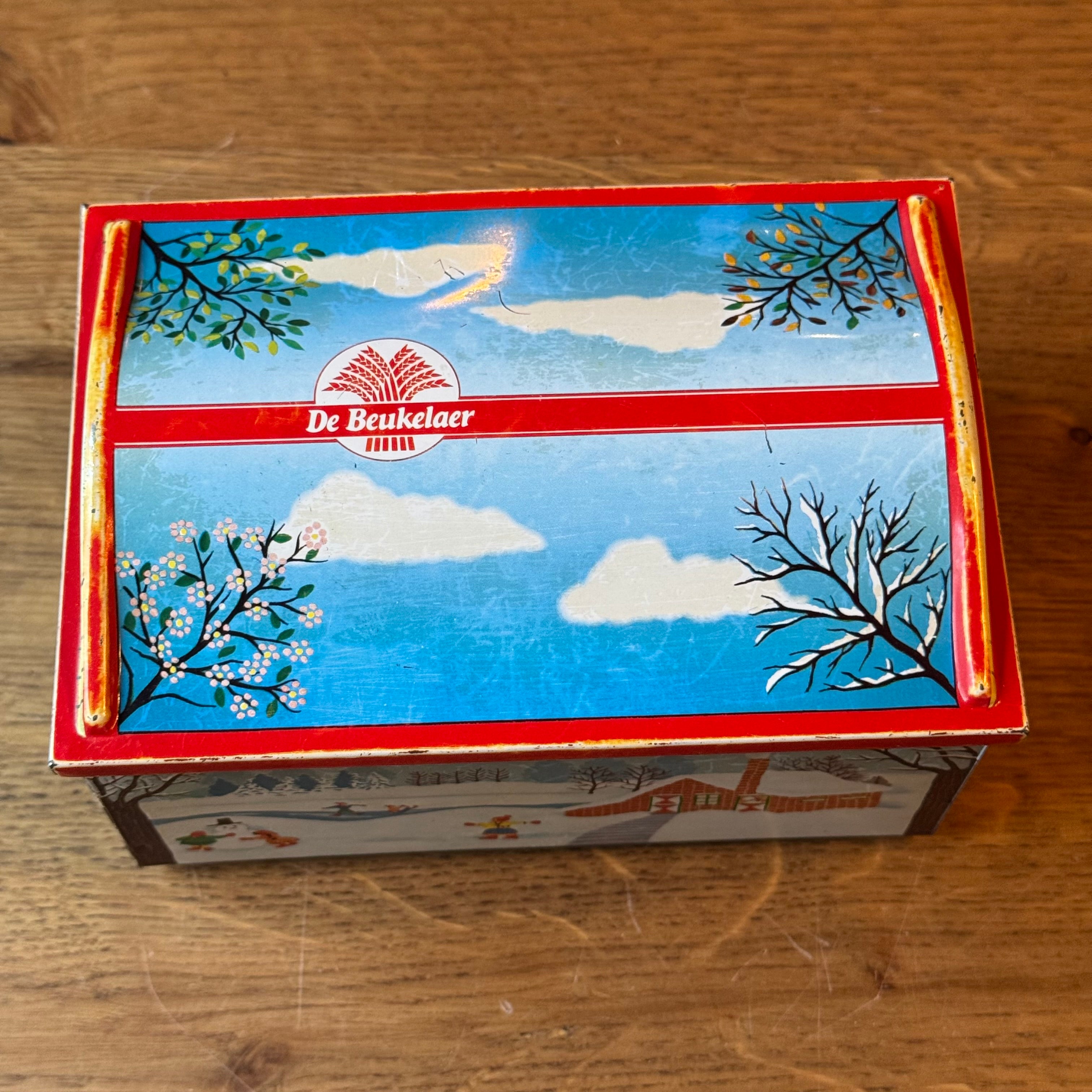 Vintage De Beukelaer tin drum with seasonal illustrations