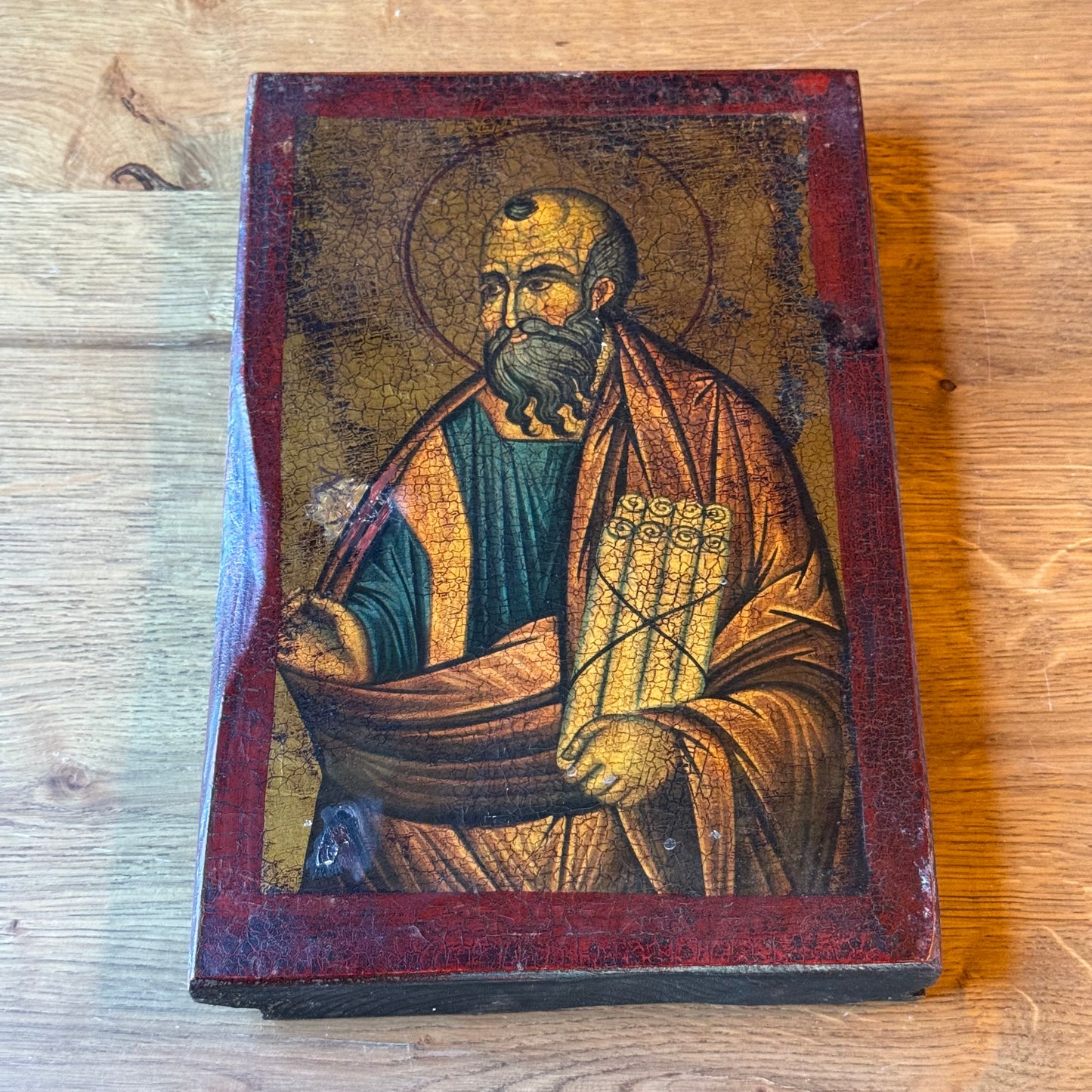 Decorative icon of an apostle on a wooden panel with a crackle patina