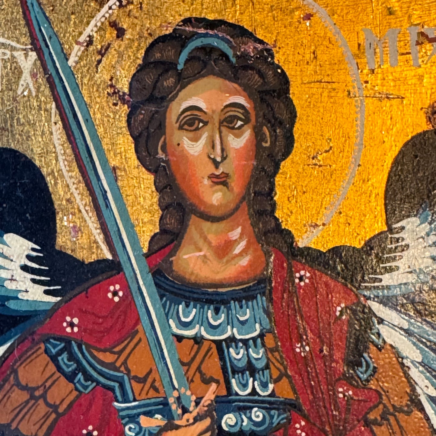 Icon of Archangel Michael with sword on wooden panel