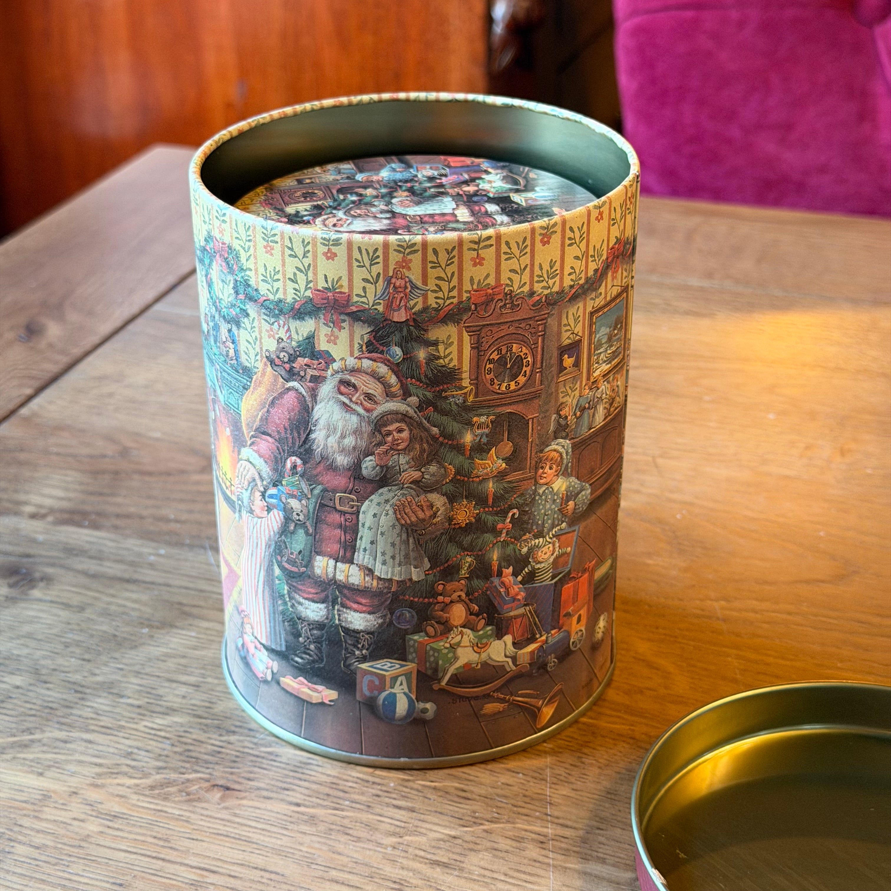 Set of three Christmas tins with a nostalgic Santa Claus illustration