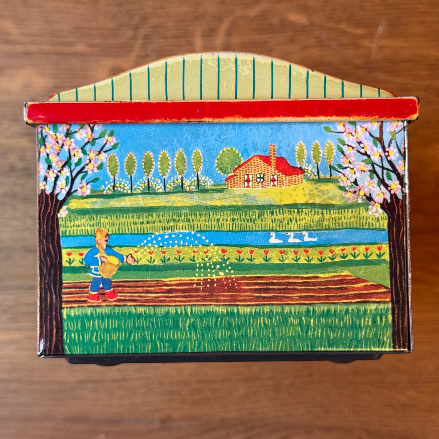 Vintage De Beukelaer blikken trommel met seizoensillustraties