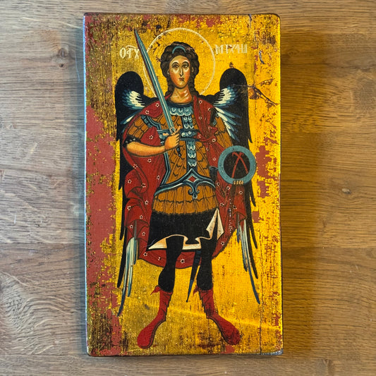 Icon of Archangel Michael with sword on wooden panel