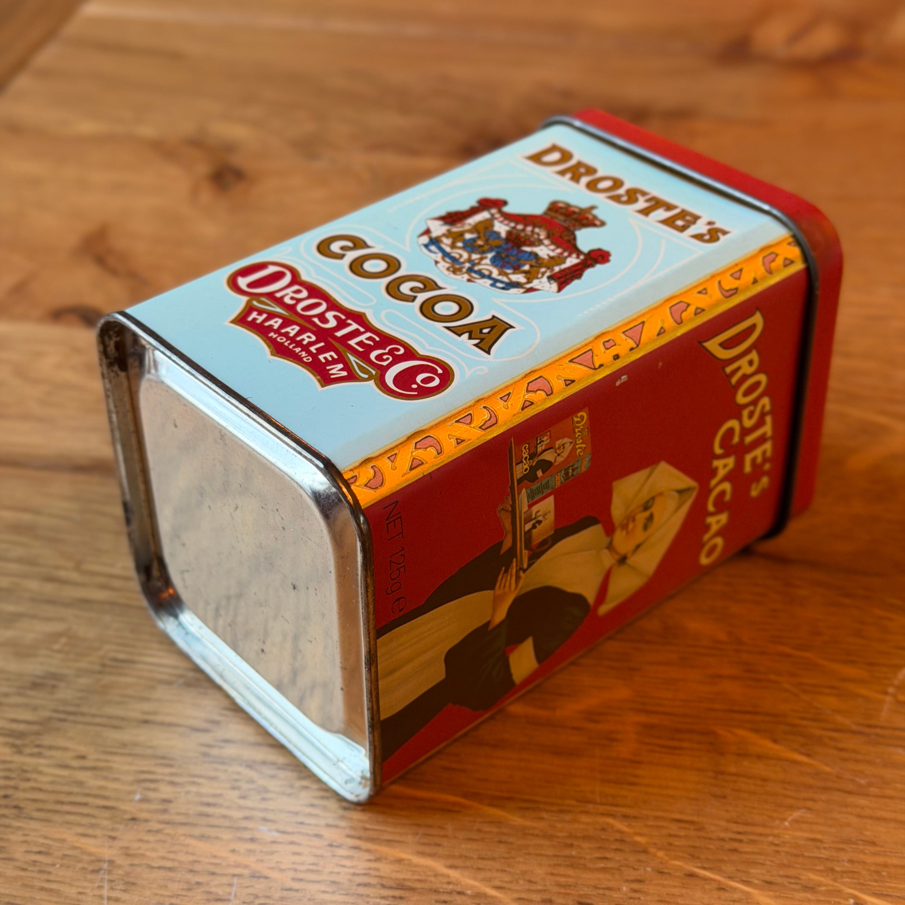 Antiek Droste’s Cocoa Blik met Opbollende Deksel en Cirkel – Exportuitvoering