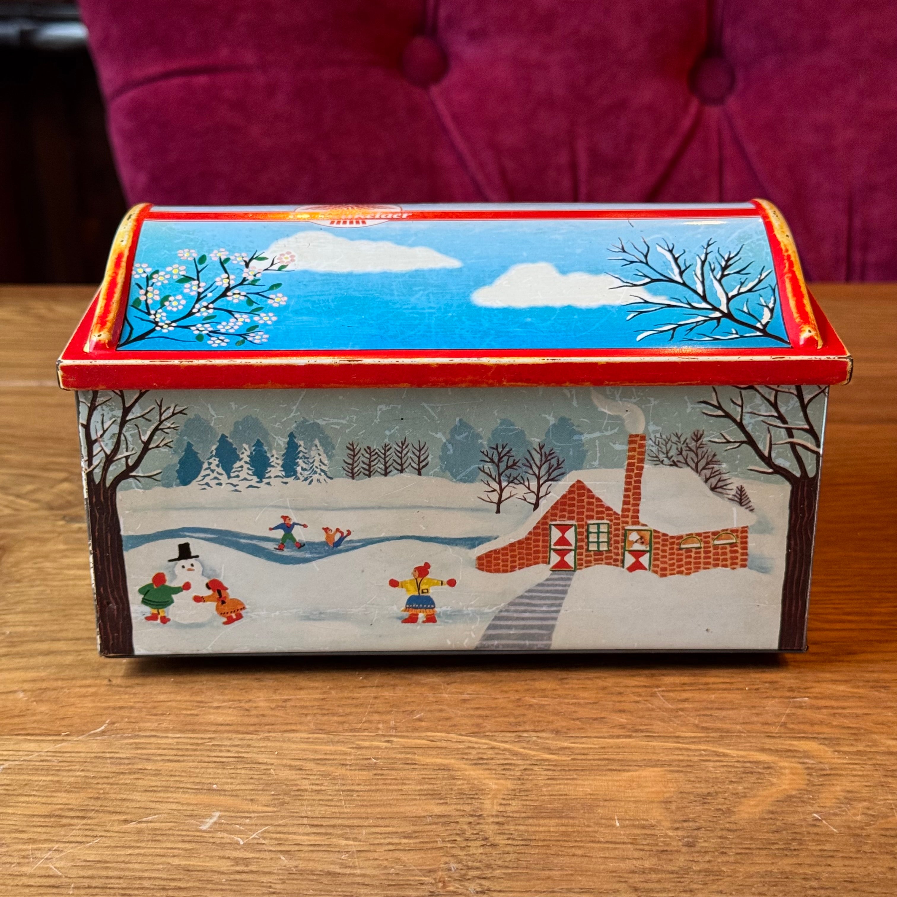 Vintage De Beukelaer tin drum with seasonal illustrations