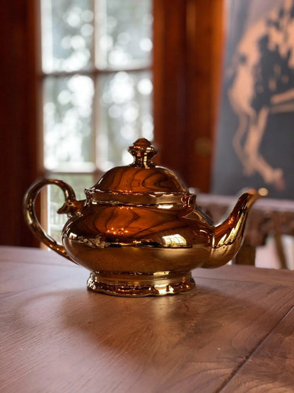 Gouden theepot - Bamestra Curiosa