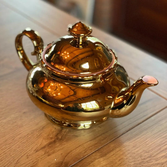 Gouden theepot - Bamestra Curiosa
