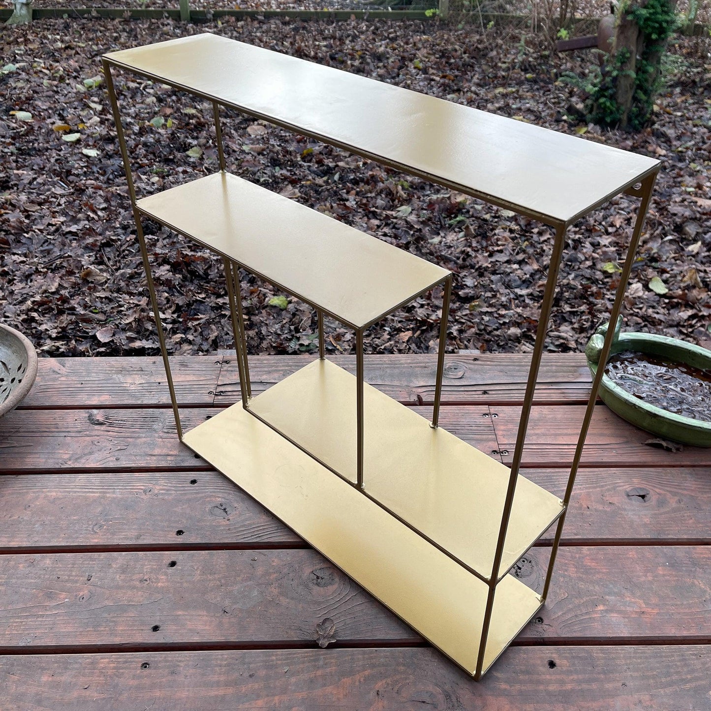 Goudkleurig wandrek van metaal - Bamestra Curiosa