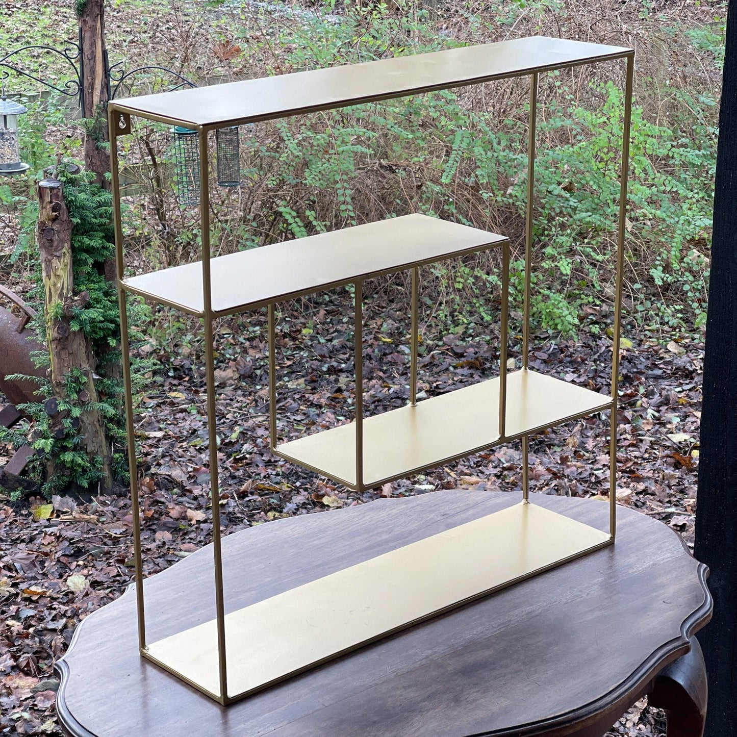 Goudkleurig wandrek van metaal - Bamestra Curiosa