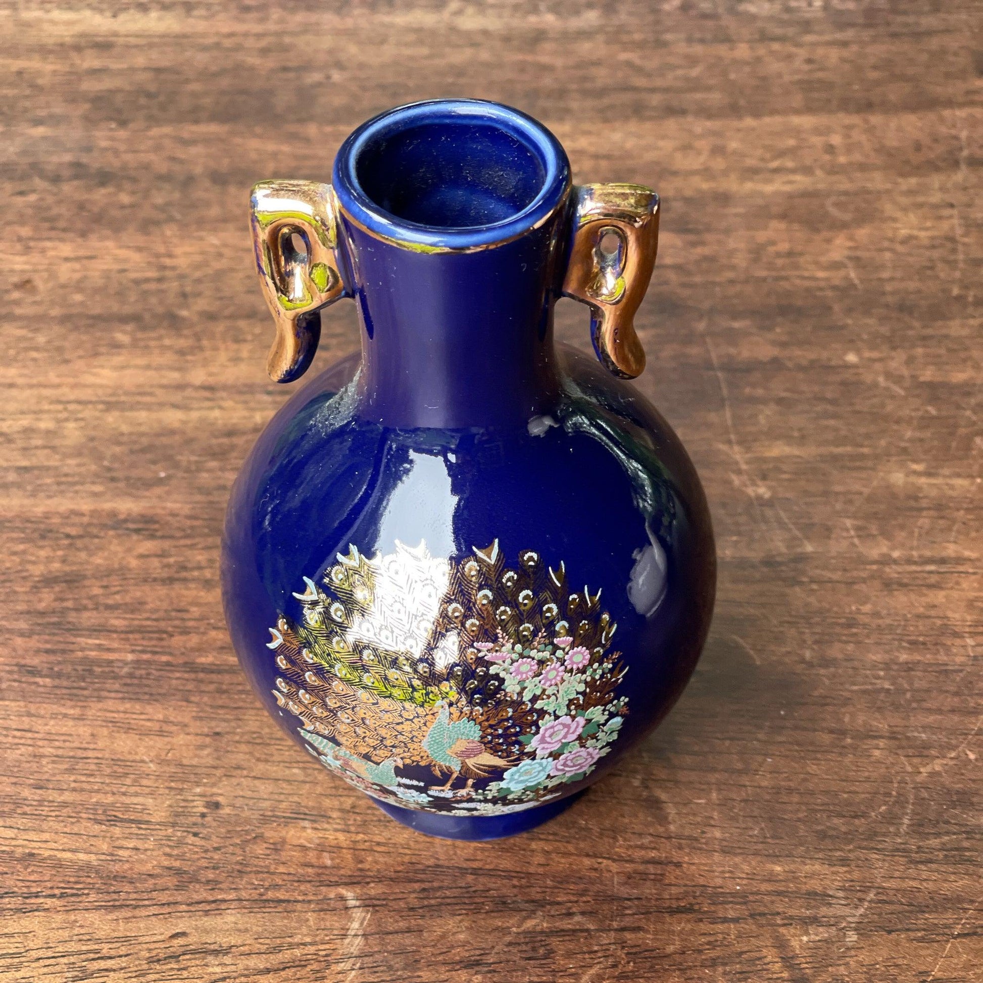 Klein blauw vaasje met een Pauw - Bamestra Curiosa